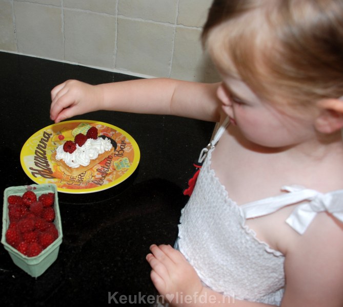 Wafel met slagroom en frambozen