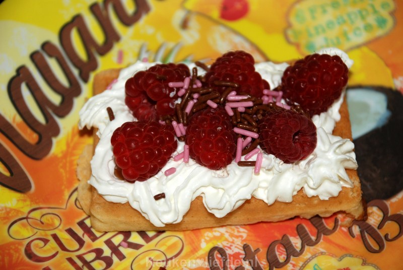Wafel met slagroom en frambozen